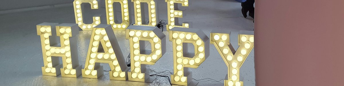 Illuminated letters spelling out the words code happy